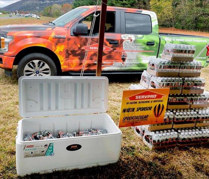 Truck, water bottles, sign