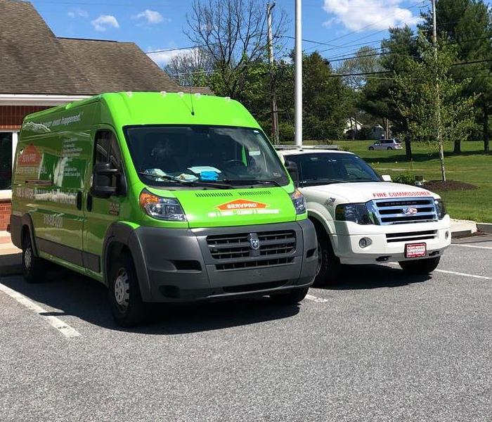 SERVPRO van outside structure.