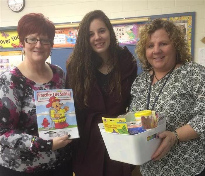 SERVPRO sales representative delivering school supplies to local teachers who suffered from a water loss in their classroom