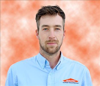 man in blue shirt with facial hair